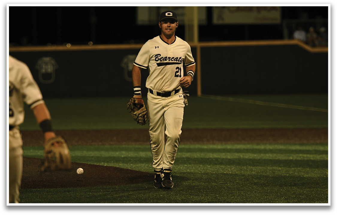 A baseball player wearing a white uniform with the number 2 on the back. Description generated by AI
