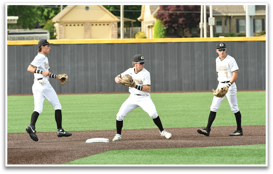 Three baseball players on a field. Description generated by AI