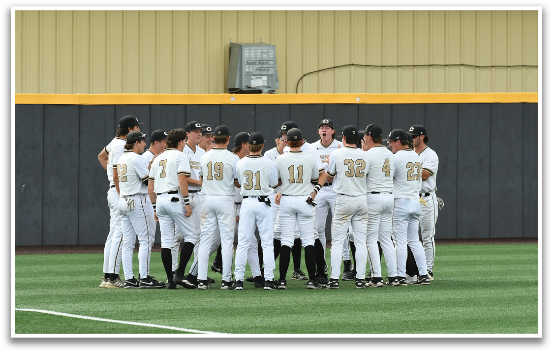A group of baseball players wearing white uniforms. Description generated by AI
