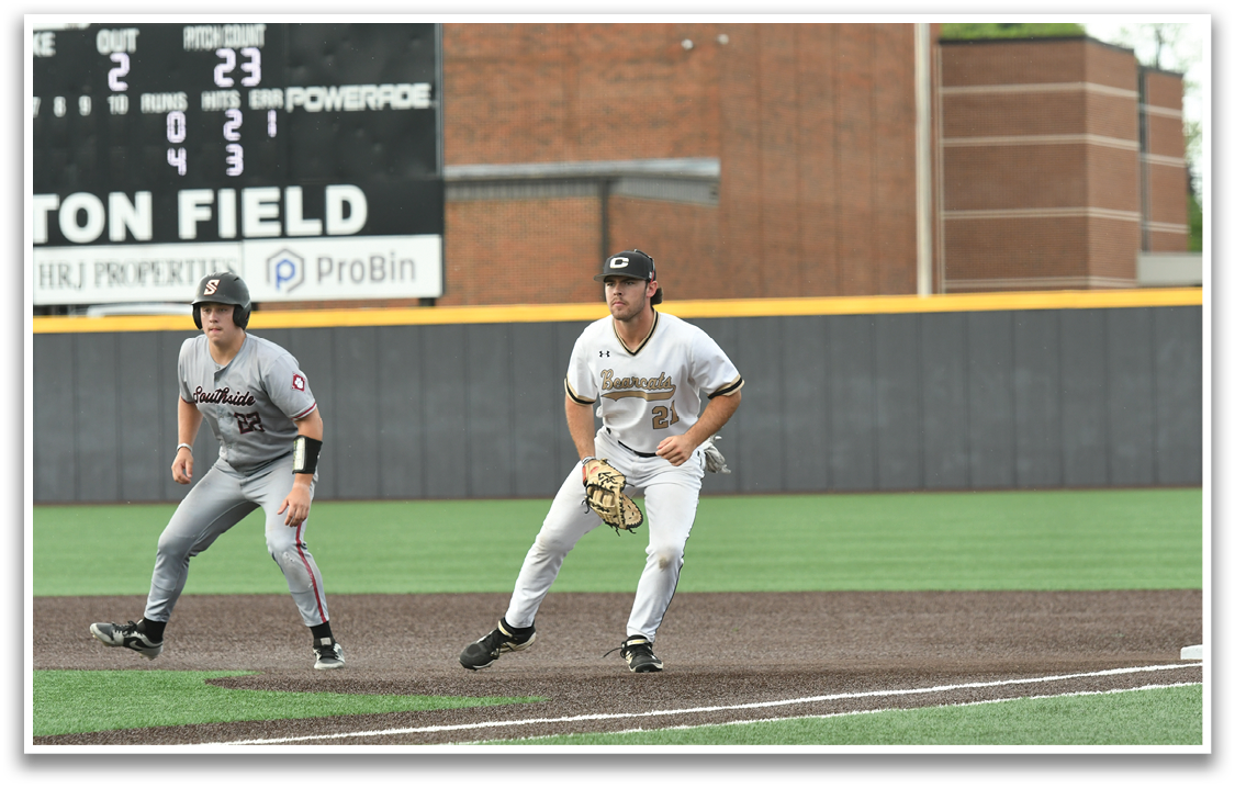 A baseball player in a white uniform is running to a base. Description generated by AI