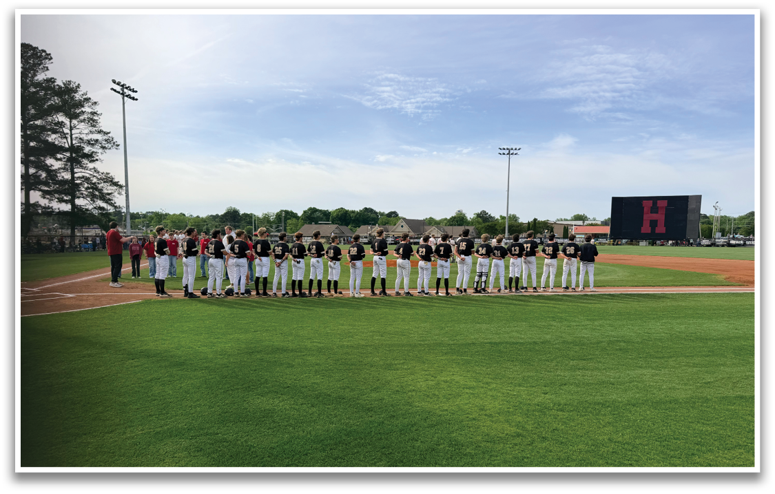 Baseball players on a field. Description generated by AI