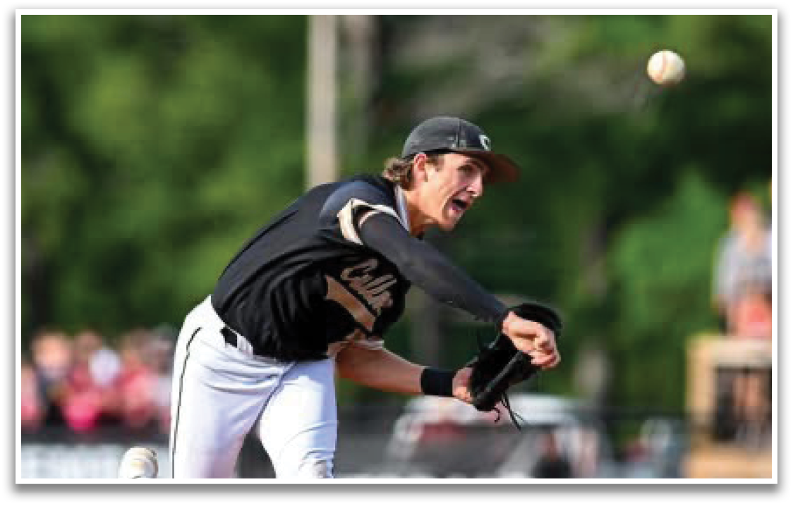 A baseball player in a black and white uniform is throwing a ball. Description generated by AI