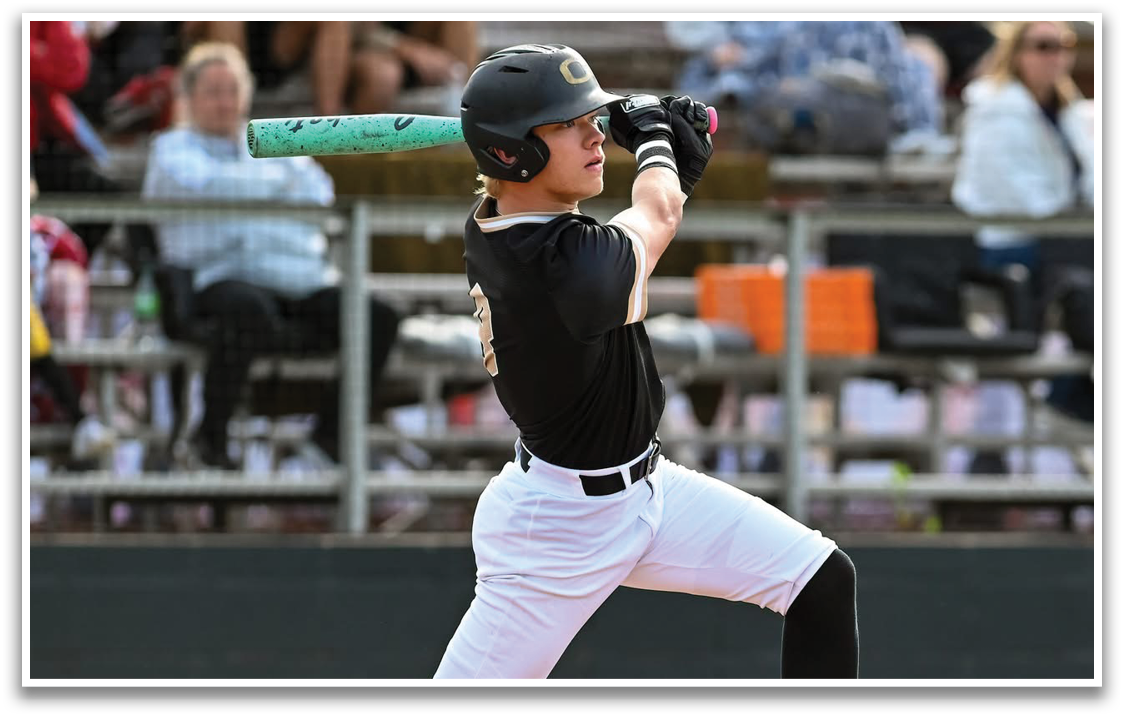 A baseball player in a black and white uniform is swinging a bat. Description generated by AI