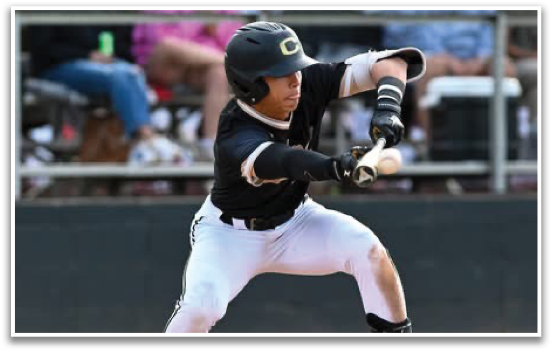 A baseball player in a black and gold uniform is swinging a bat. Description generated by AI