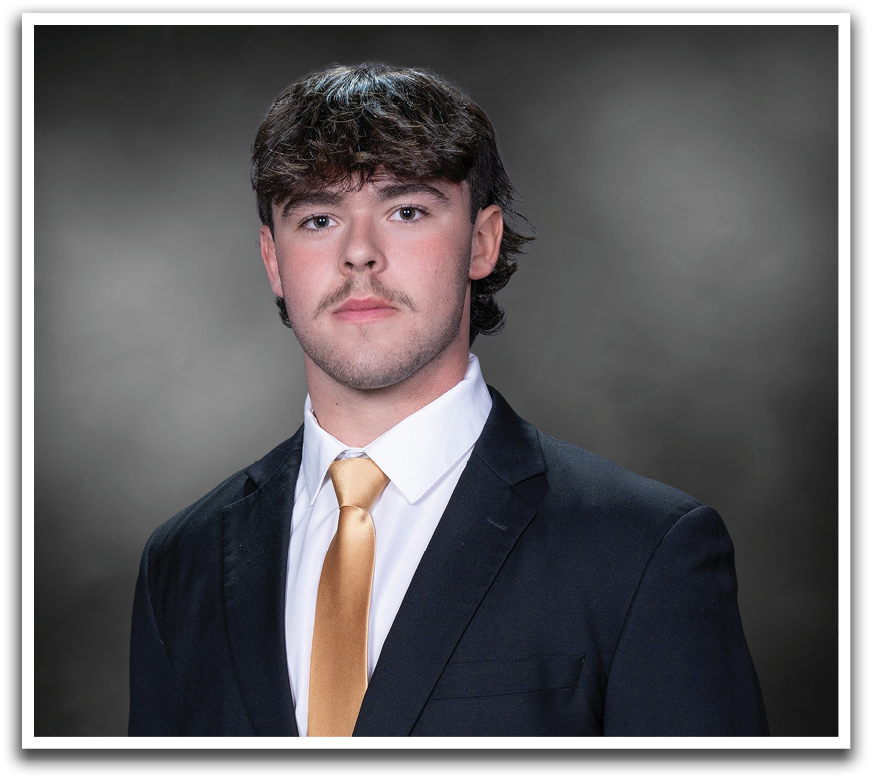 A man wearing a suit and tie stands in front of a black background. AI generated content