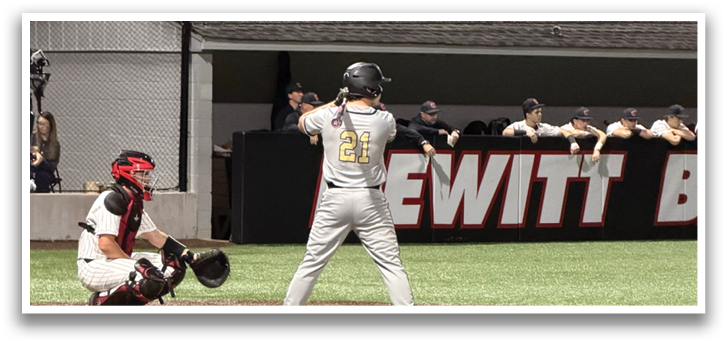 A baseball player is at bat, holding a bat and preparing to swing. AI generated content