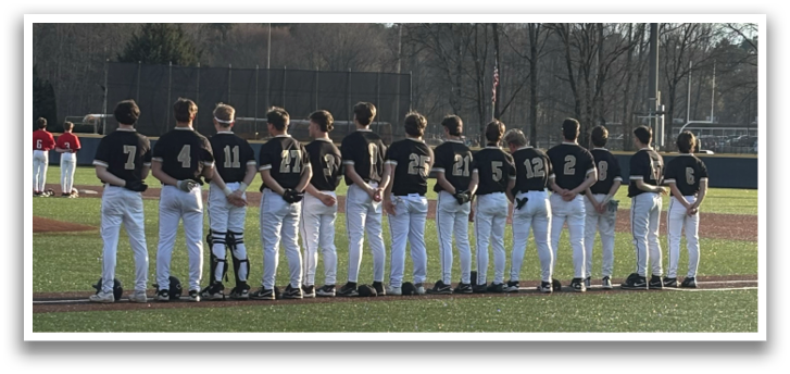 A group of young men wearing baseball uniforms stand on a field. AI generated content