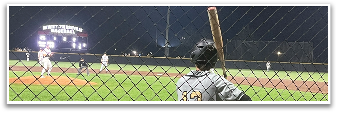 A baseball player is standing on a field holding a bat, ready to swing. AI generated content