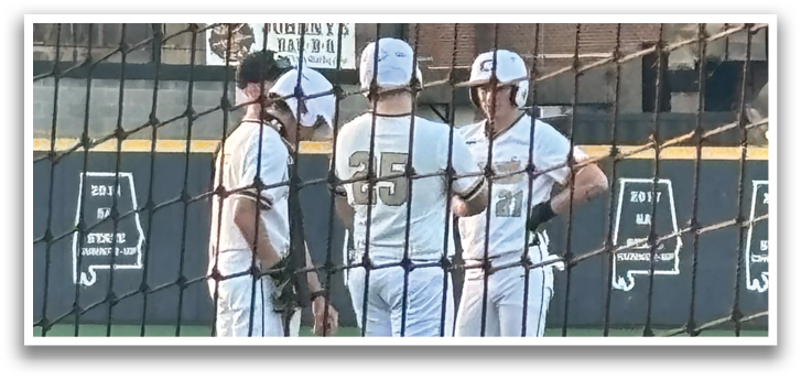 Three baseball players wearing white uniforms are standing on a field. AI generated content