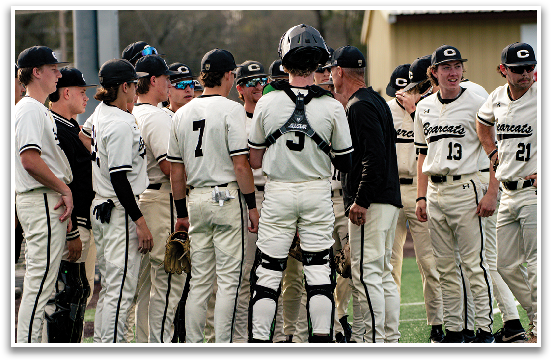 A group of baseball players wearing white uniforms and black helmets are standing on a field. AI generated content