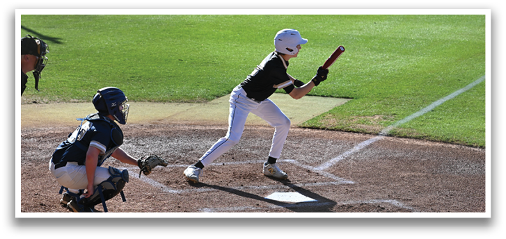 A baseball player is swinging a bat at a ball during a game. AI generated content