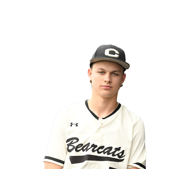 A young man wearing a baseball uniform and a hat poses for a picture. AI generated content