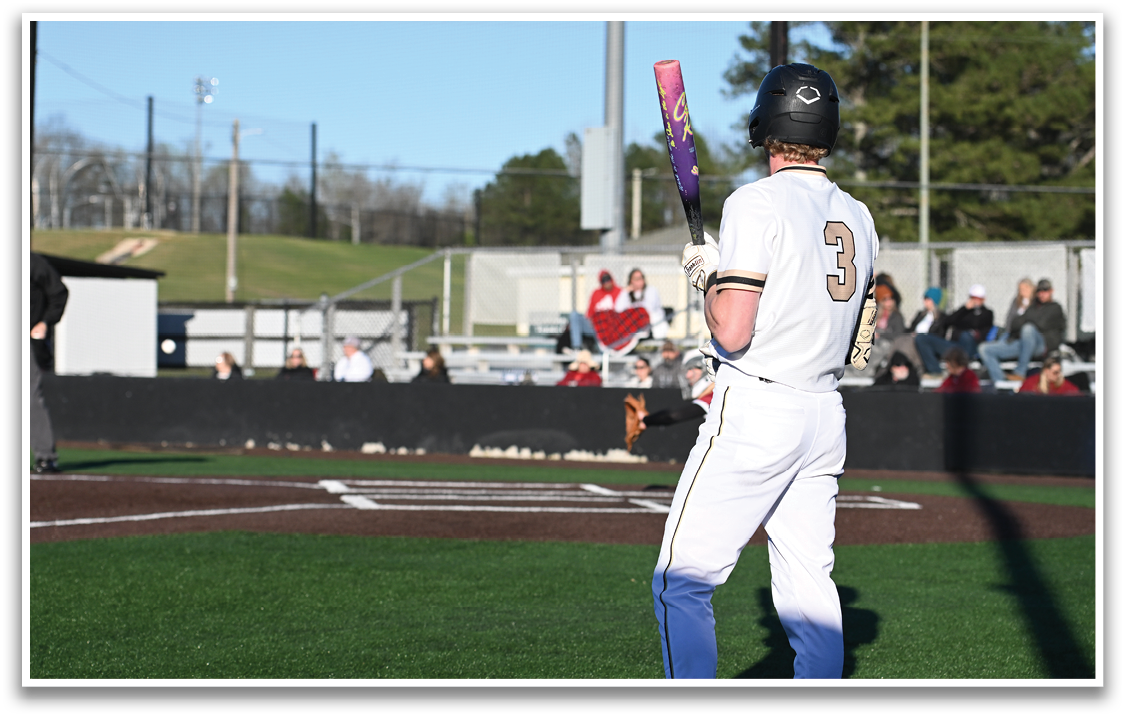 A baseball player in a white uniform is holding a bat and waiting for the pitch. AI generated content