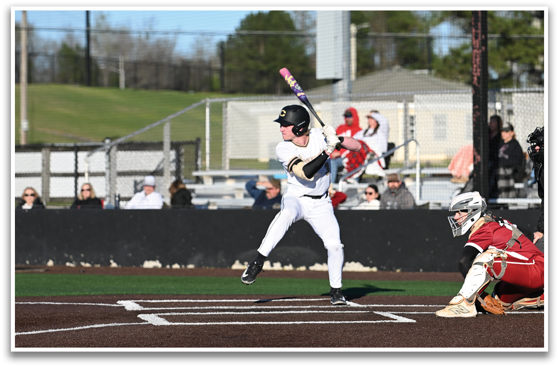 A baseball player is swinging a bat at a ball during a game. AI generated content