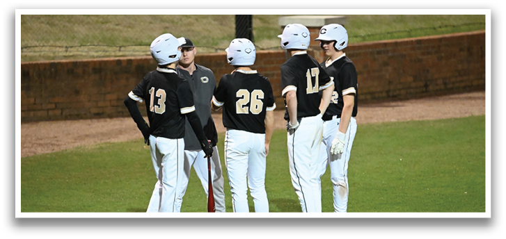 A group of baseball players wearing helmets and uniforms are standing on a field. AI generated content