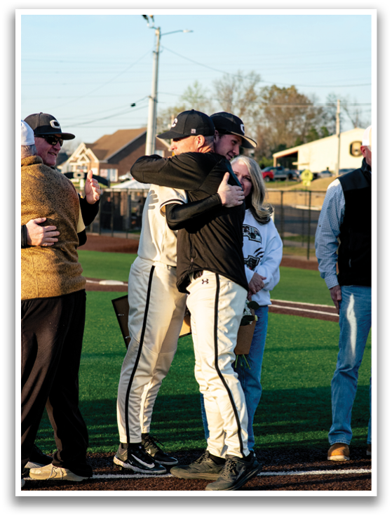 Two baseball players hugging each other on the field. AI generated content