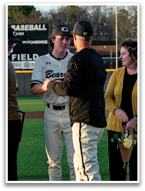A group of people, including a baseball player, are standing on a field. AI generated content