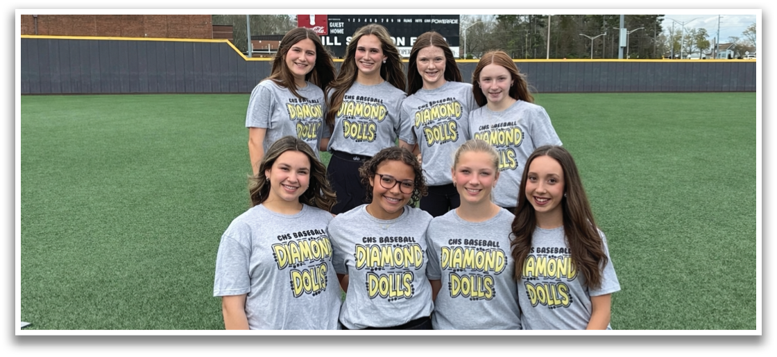 A group of girls wearing grey shirts and black shorts pose for a photo on a field. AI generated content