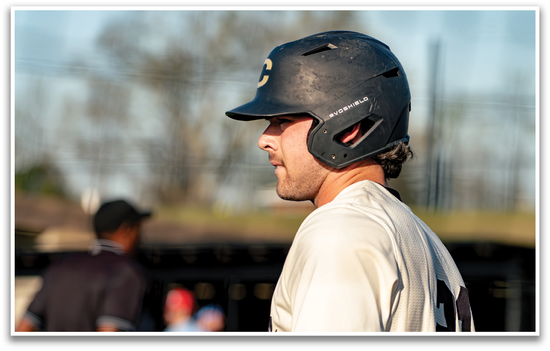 A baseball player wearing a helmet and a white shirt. AI generated content