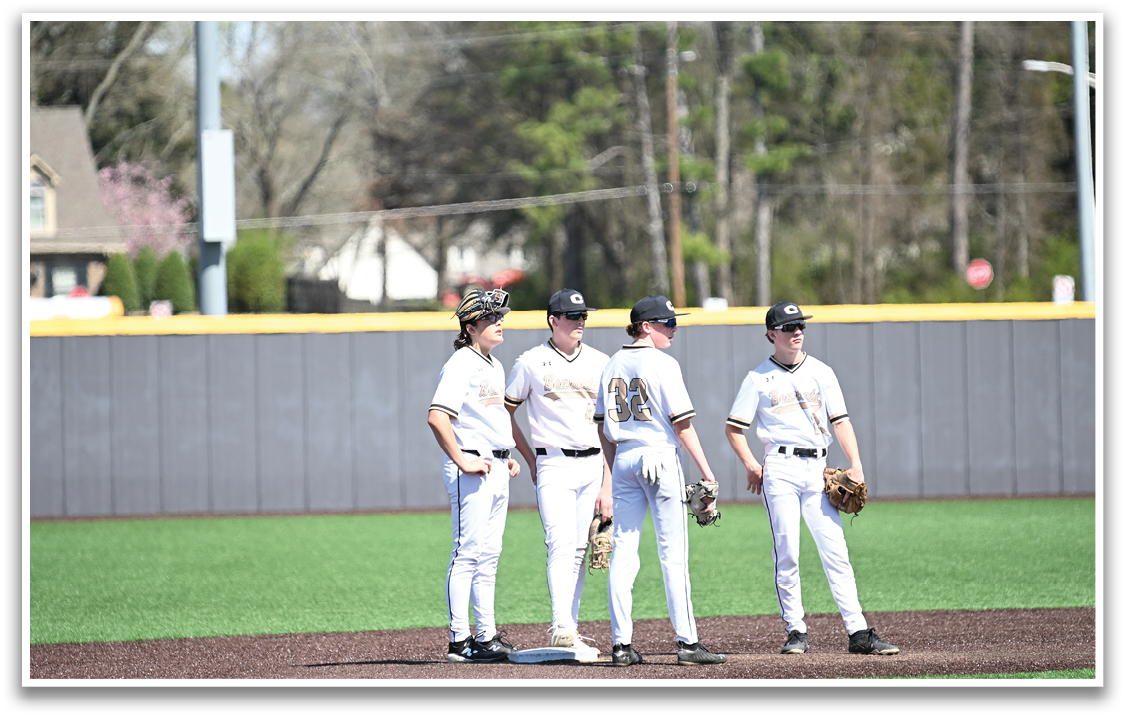 Four baseball players standing on a field, wearing white uniforms and holding baseball gloves. AI generated content