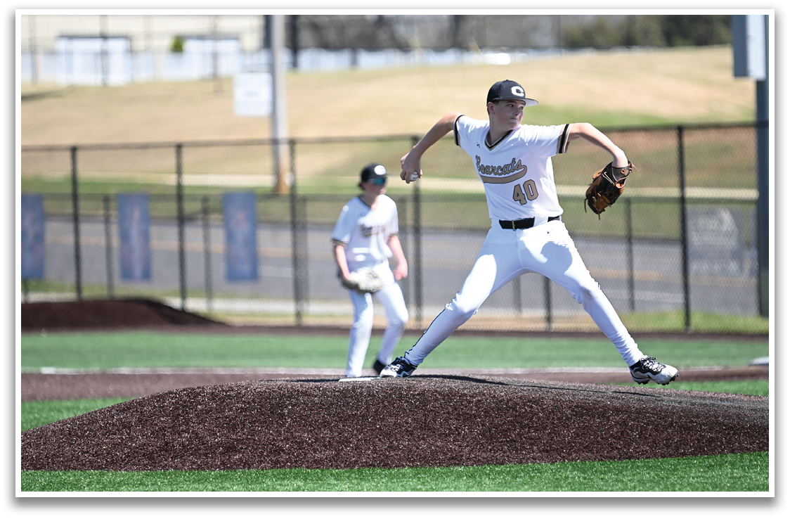 A baseball player in a white uniform is pitching a ball on a field. AI generated content