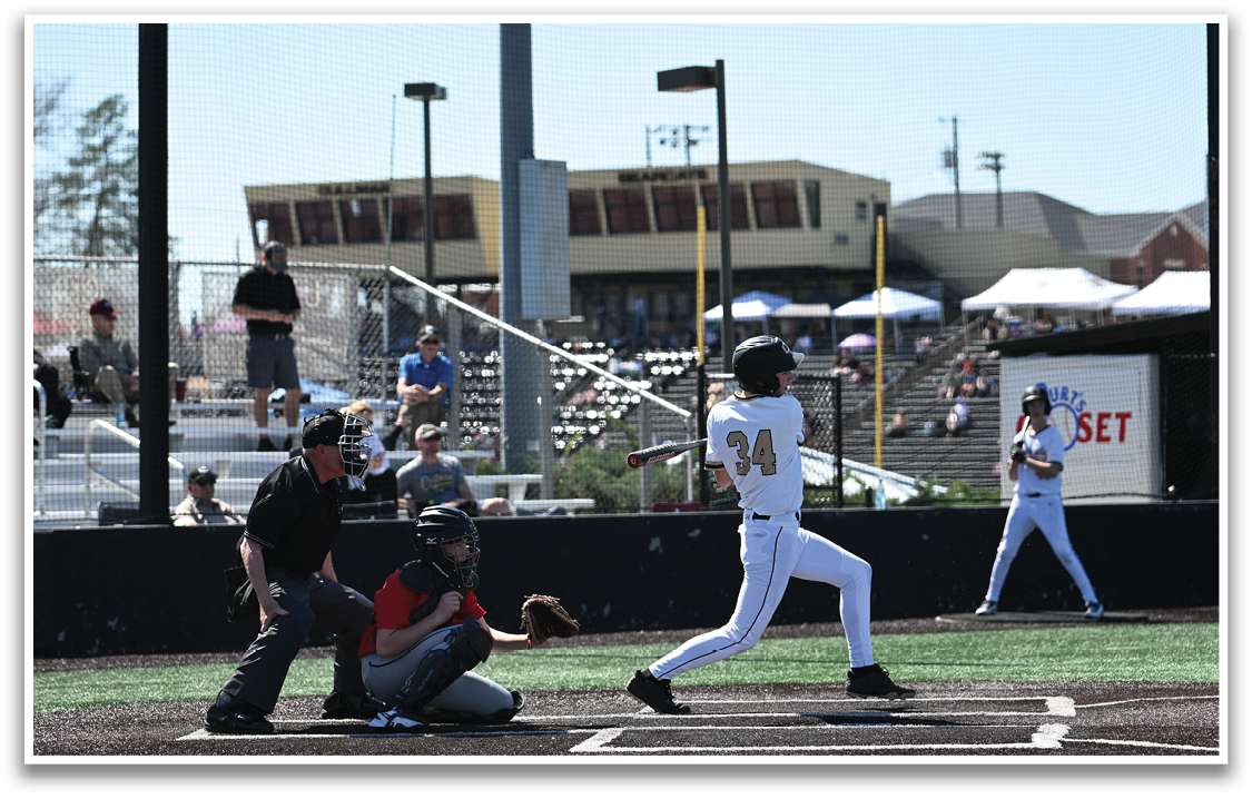 A baseball player is swinging a bat at a ball during a game. AI generated content