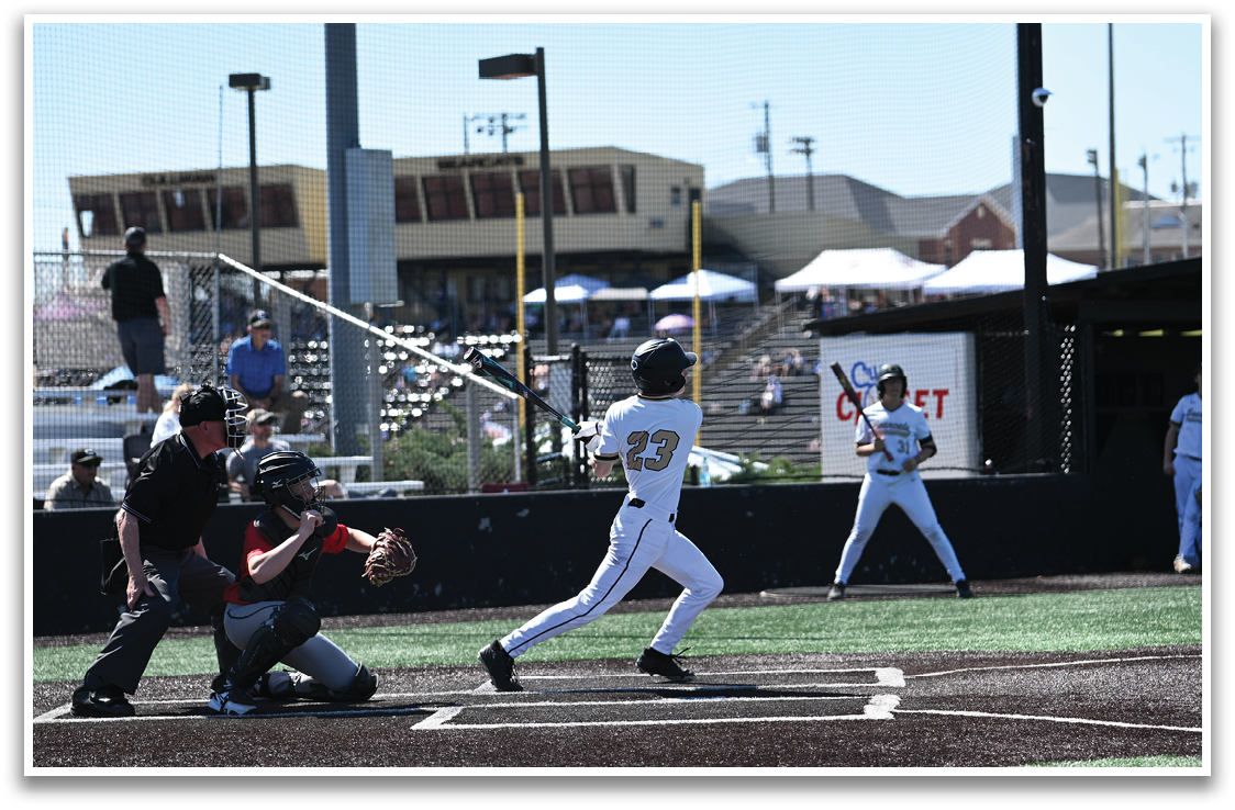 A baseball player is swinging a bat at a ball during a game. AI generated content