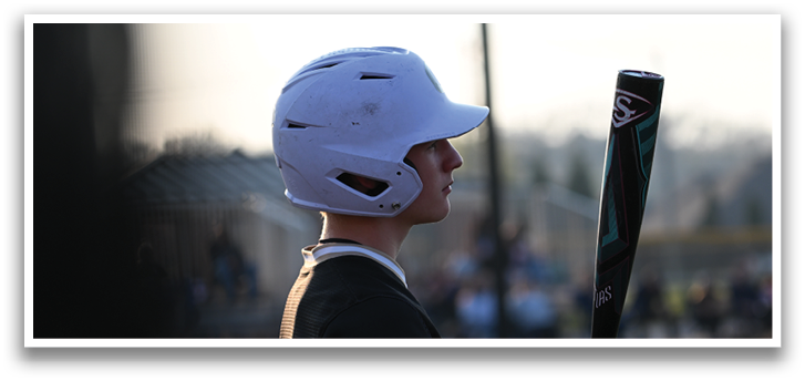 A baseball player holding a bat and wearing a helmet. AI generated content
