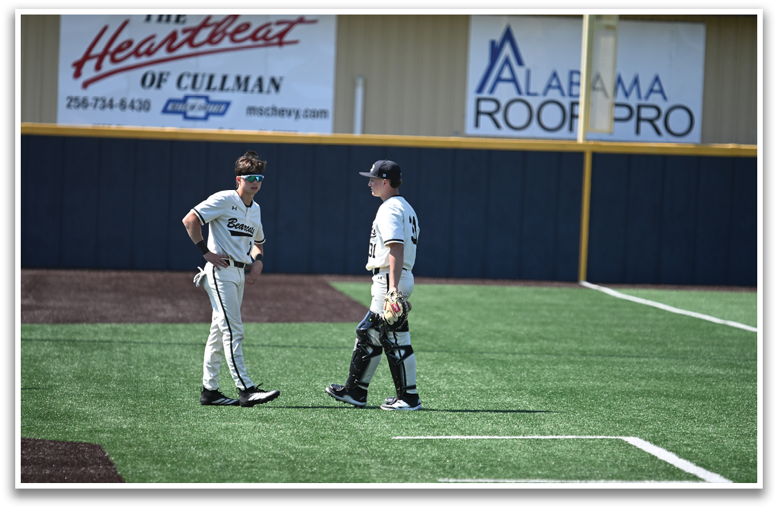 Two baseball players standing on a field, talking to each other. AI generated content