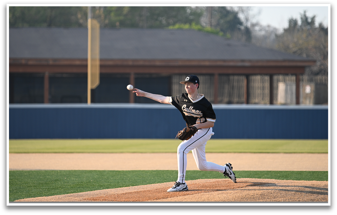 A baseball player in a black and white uniform is pitching a ball on a field. AI generated content