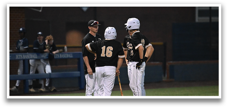 Three baseball players wearing white uniforms are standing on a field. They are holding baseball bats and talking to each other. AI generated content