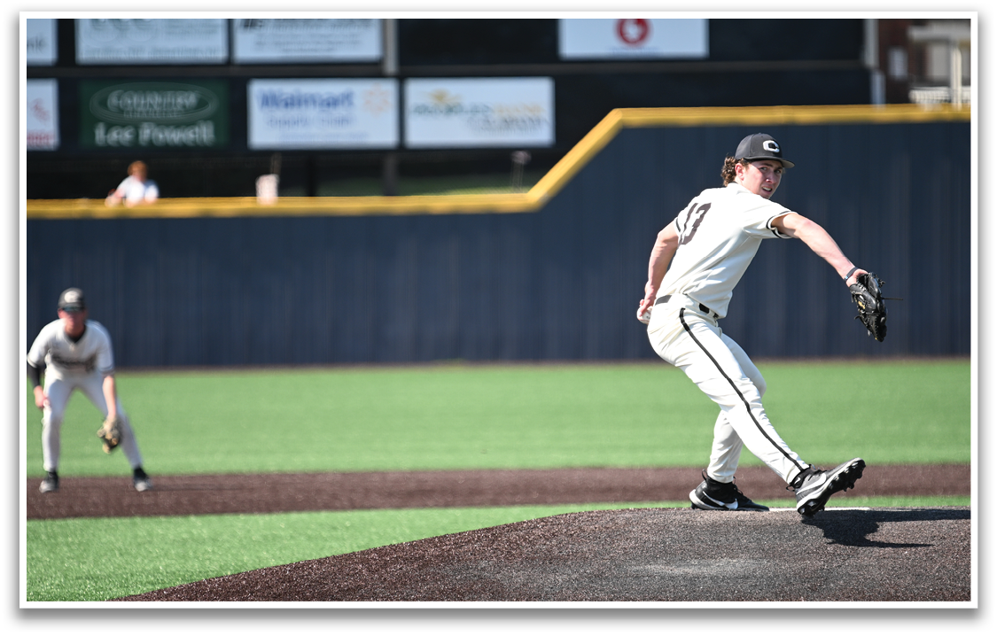 A baseball player in a white uniform is pitching a ball on a field. AI generated content