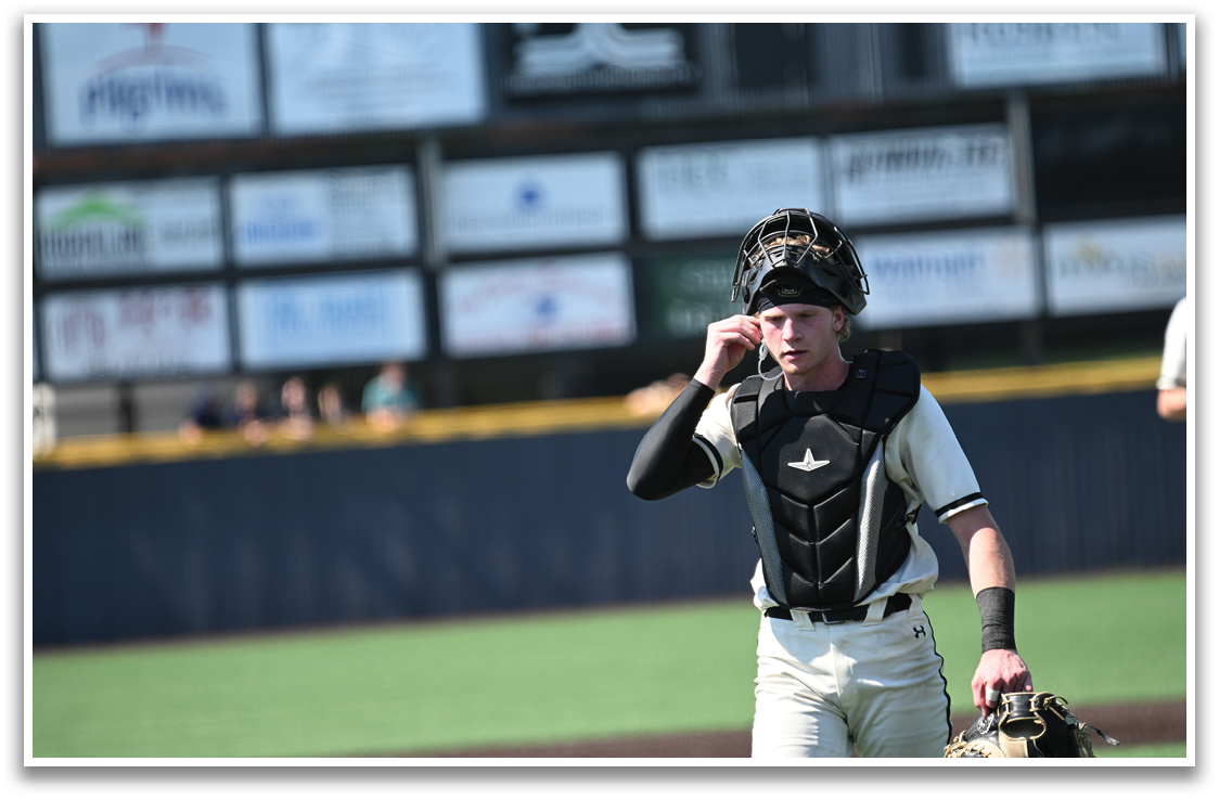 A baseball player wearing a helmet and catcher's gear. AI generated content