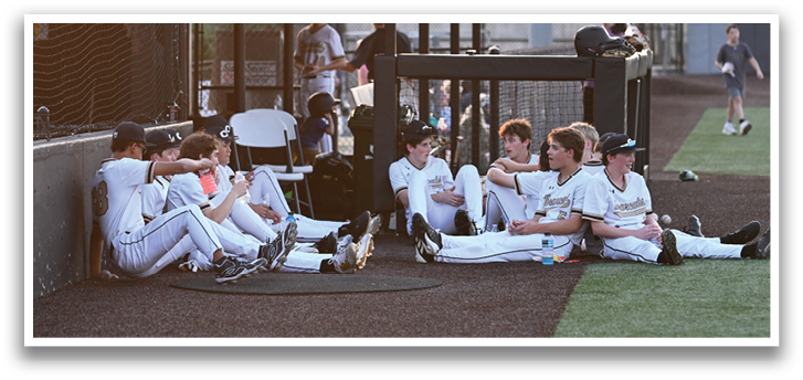 Baseball players sitting on the grass. AI generated content