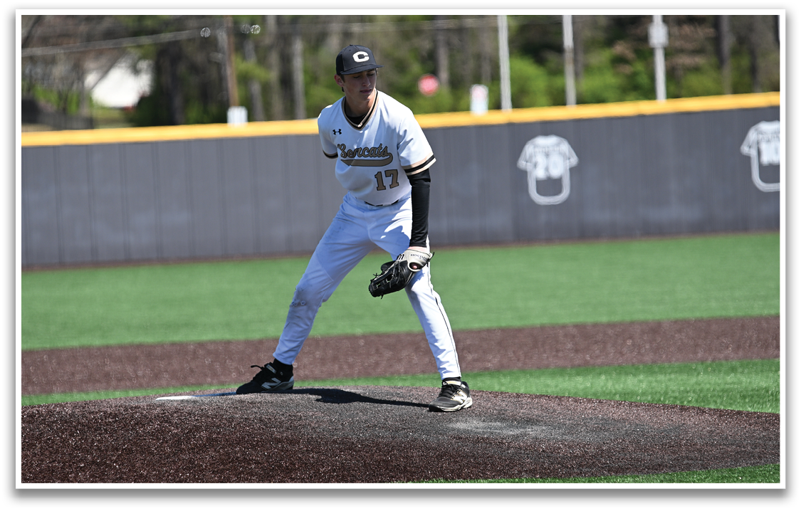 A baseball player in a white uniform is standing on the pitcher's mound, preparing to throw the ball. AI generated content