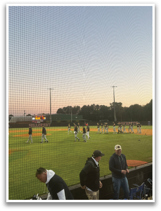 A group of people are standing on a baseball field. AI generated content