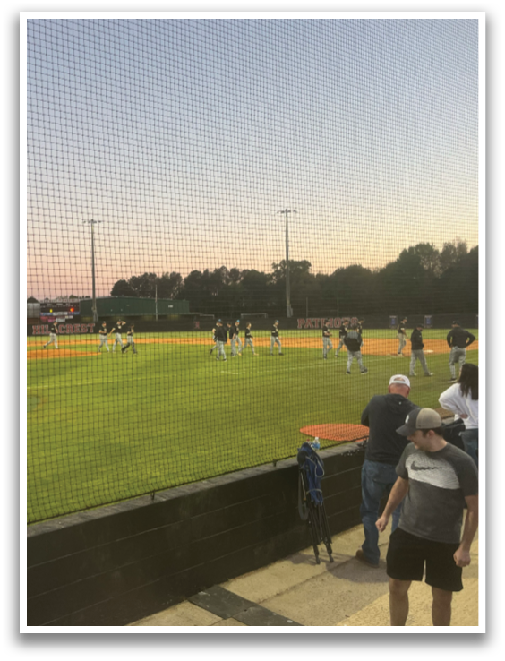 A baseball game is taking place with a crowd of people watching. AI generated content