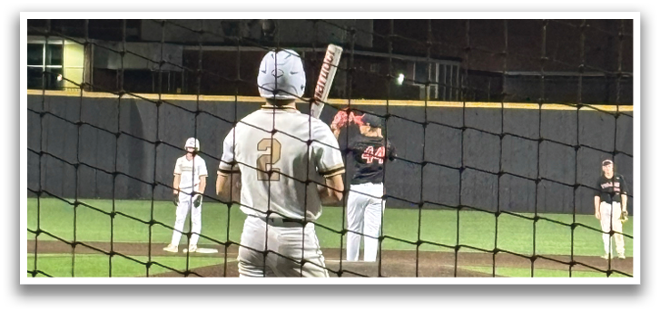 A baseball player is holding a bat, getting ready to hit the ball. AI generated content