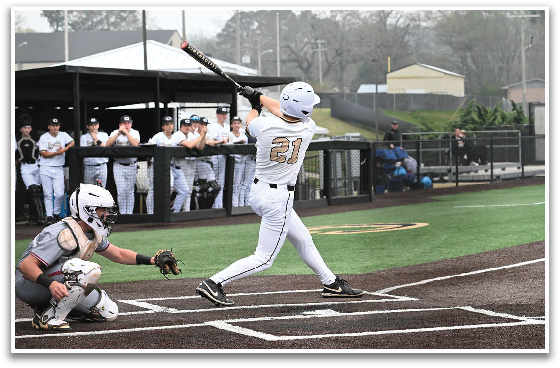 A baseball player is swinging a bat at a ball during a game. AI generated content
