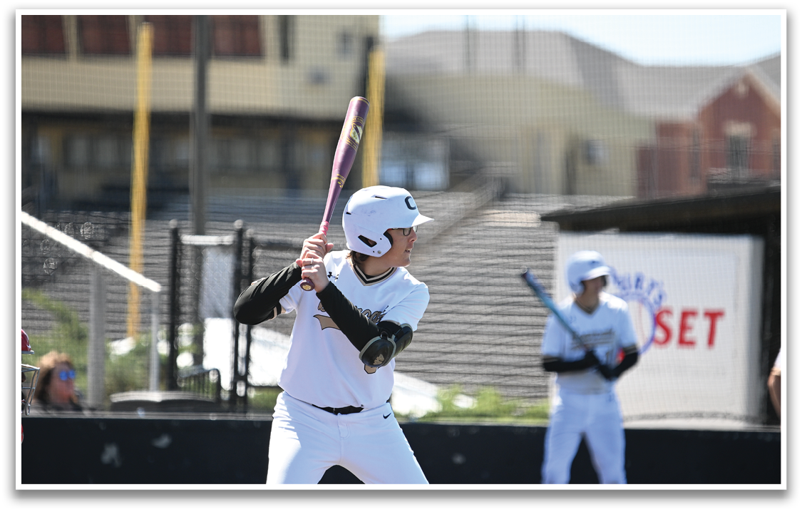 A baseball player in a white uniform is swinging a bat at a ball. AI generated content