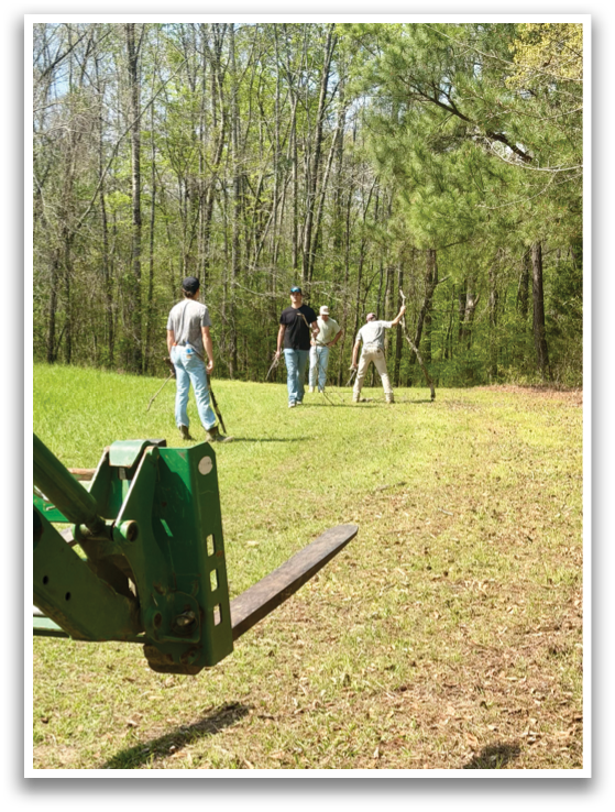 Three men are playing frisbee in a grassy field. AI generated content