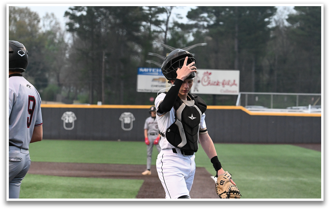 A baseball player wearing a black helmet and a catcher's mitt is walking on the field. AI generated content