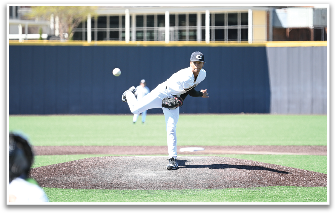 A baseball player in a white uniform is pitching a ball on a field. AI generated content