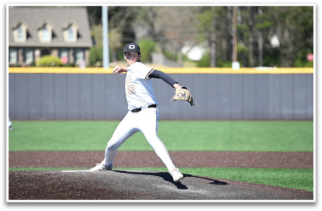 A baseball player in a white uniform is pitching a ball on a field. AI generated content