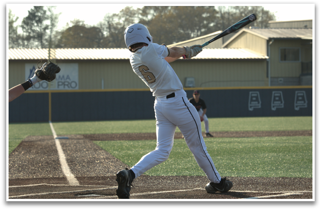 A baseball player in a white uniform is swinging a bat at a ball. AI generated content