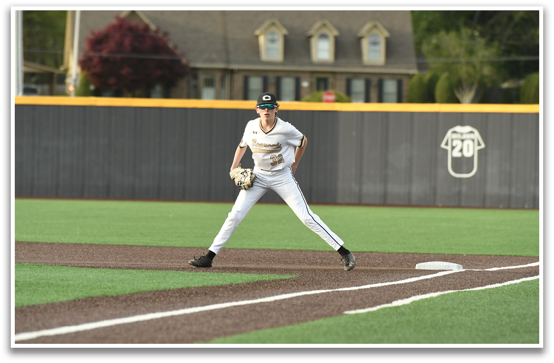 A baseball player in a white uniform is standing on the pitcher's mound, preparing to throw the ball. AI generated content