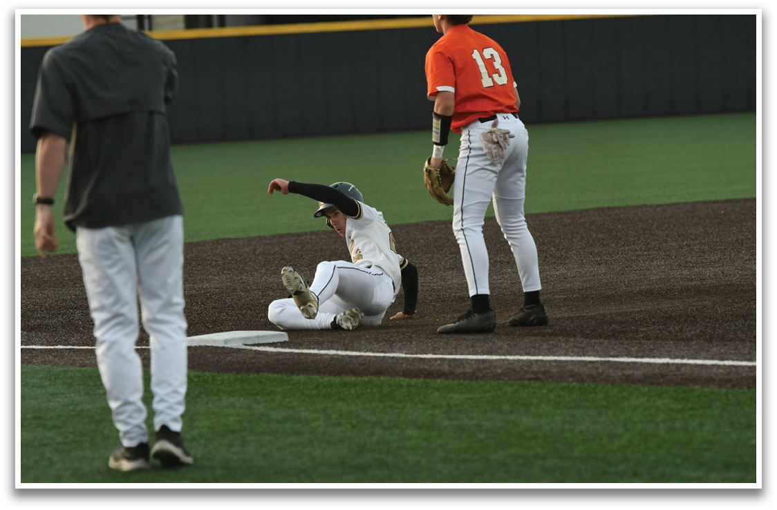 A baseball player slides into home plate, while another player watches. AI generated content