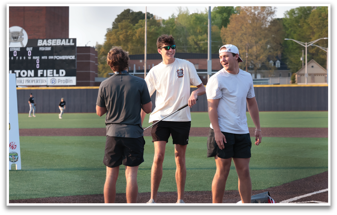 Three men standing on a baseball field, two of them wearing sunglasses. AI generated content
