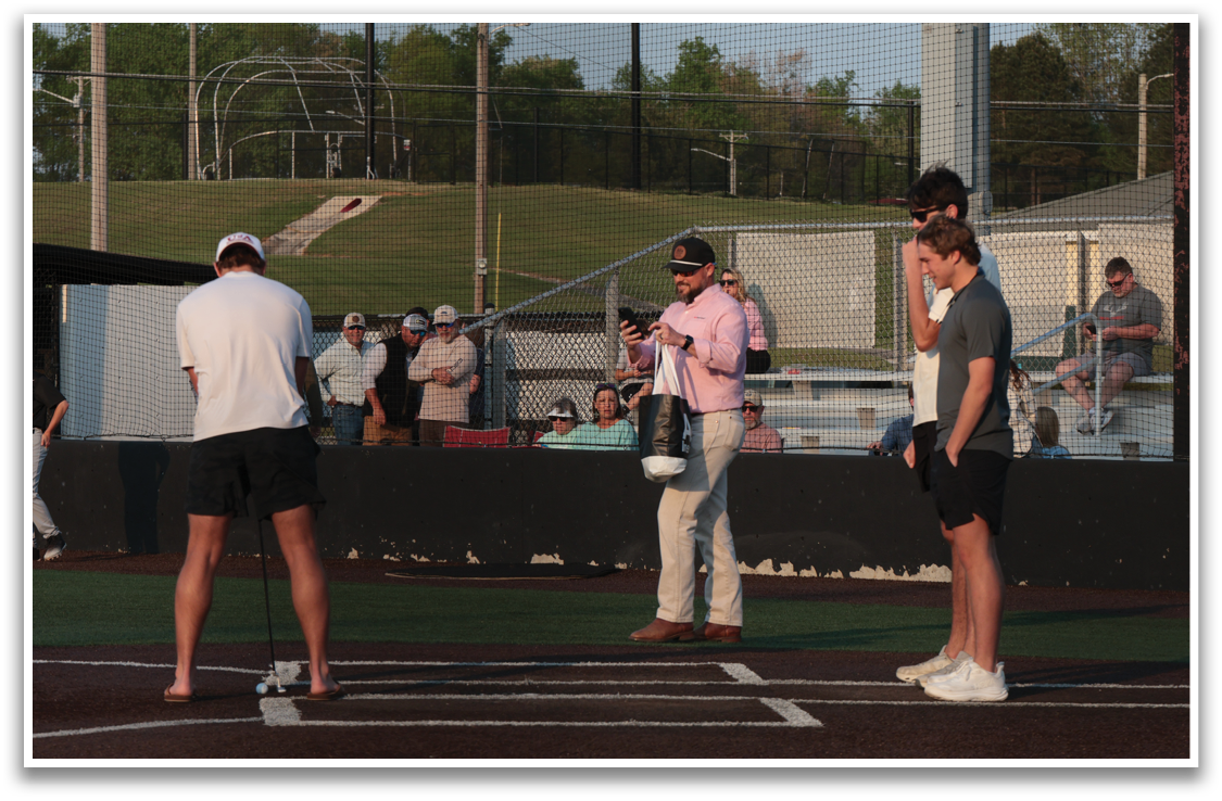Three men are standing on a baseball field, one of them holding a baseball bat. They are surrounded by a crowd of people who are watching the game. AI generated content