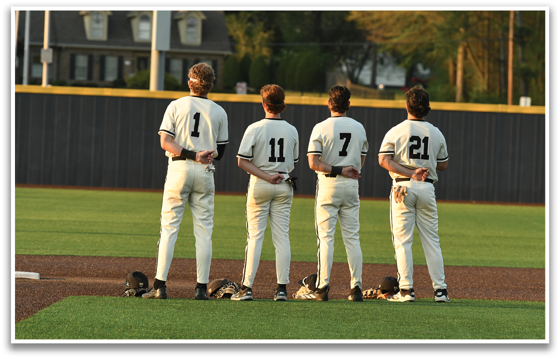 Four baseball players standing on a field, wearing white uniforms and holding gloves. AI generated content